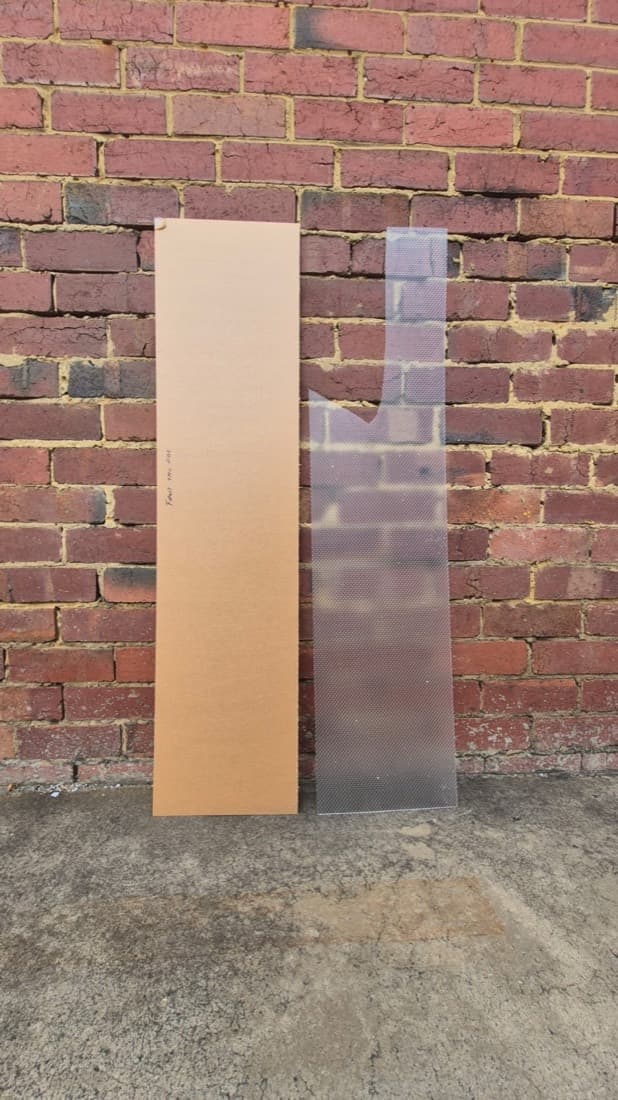 Cut-to-size cardboard sheet and clear corrugated polycarbonate sheet construction materials