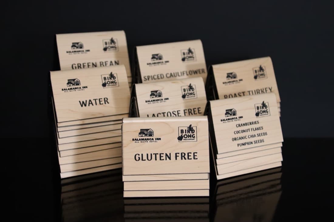 Engraved wooden 'Gluten Free' food labels for an event catering display