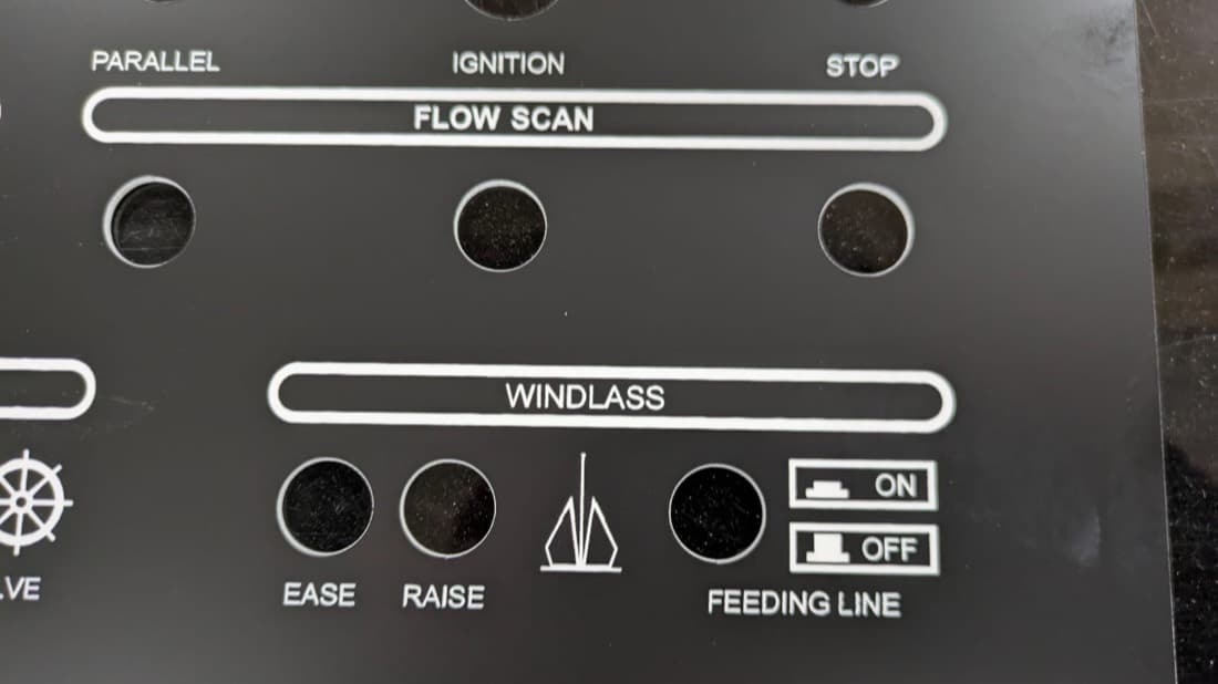 Laser-engraved black acrylic boat control panel with windlass, ignition and flow scan labels