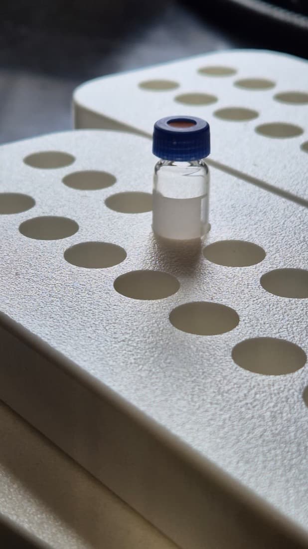 Custom white foam laboratory rack holding a capped sample vial for the medical sector