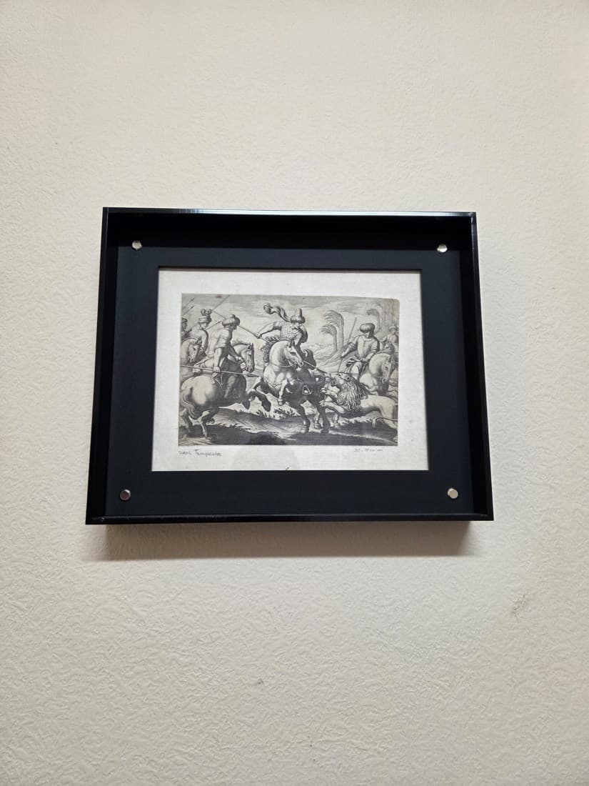Framed antique engraving displayed in a black acrylic float frame