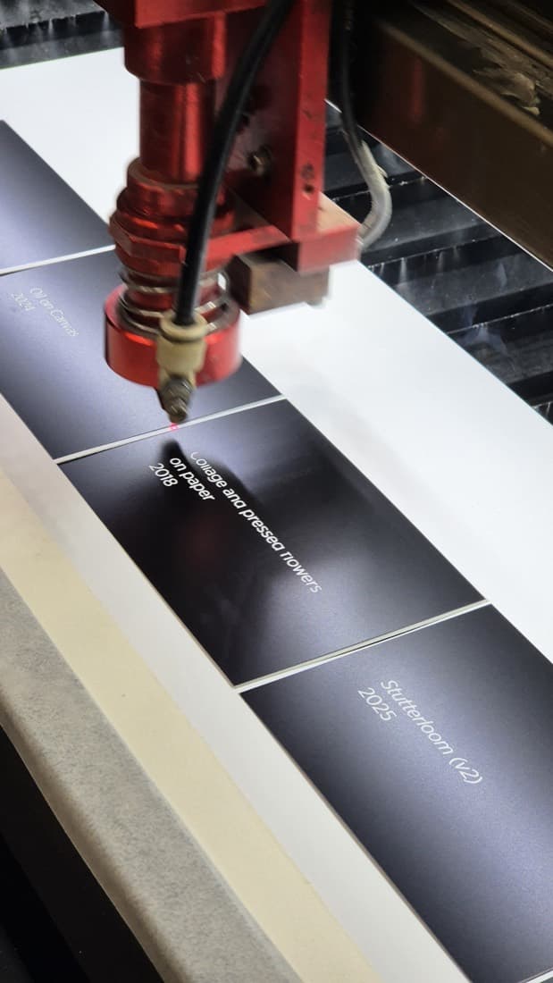 Laser engraving exhibition label panels on the laser cutter bed