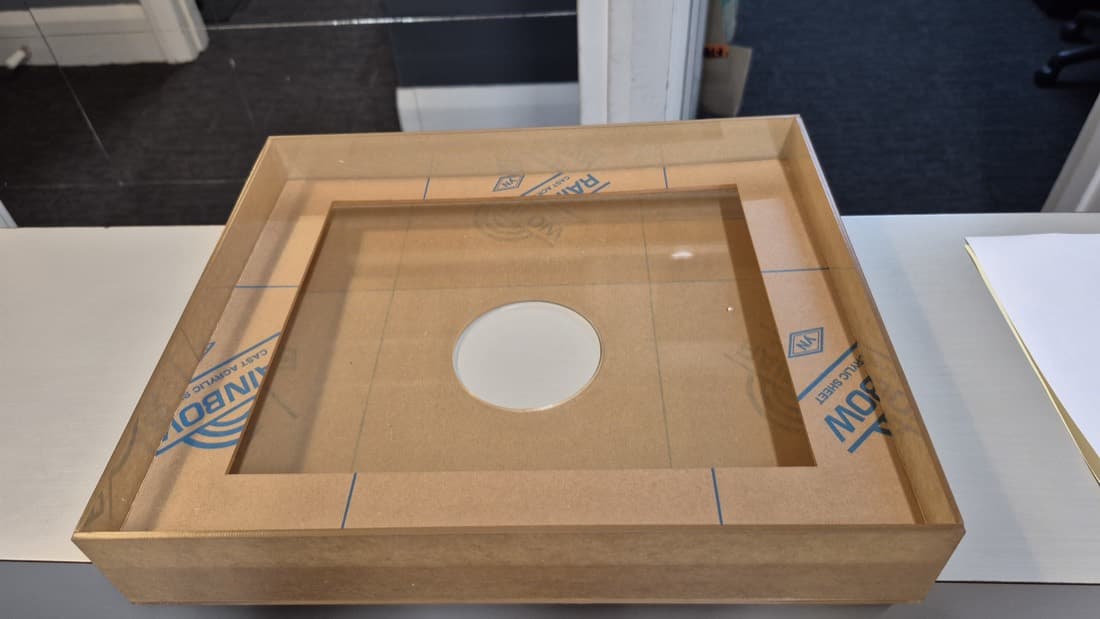 Clear acrylic and MDF display case for exhibits, top-down view