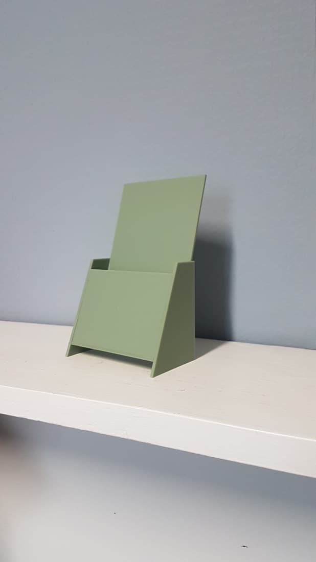 Sage-green acrylic brochure and leaflet holder for visitor information