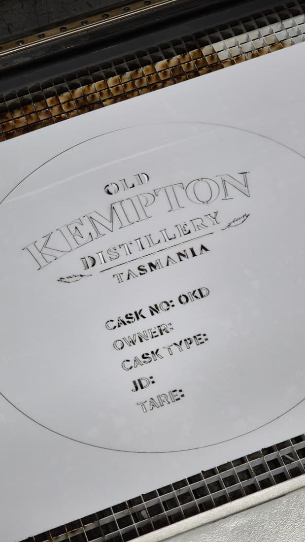 Laser-engraved Old Kempton Distillery Tasmania cask end plate showing cask number, owner and cask type fields